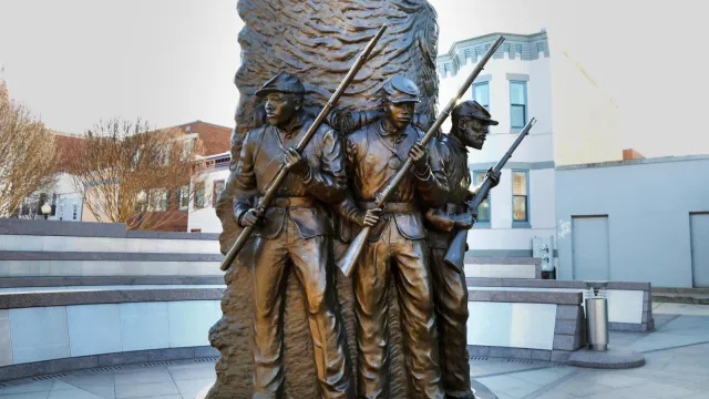 Bronze statue of African American Civil War soldiers.