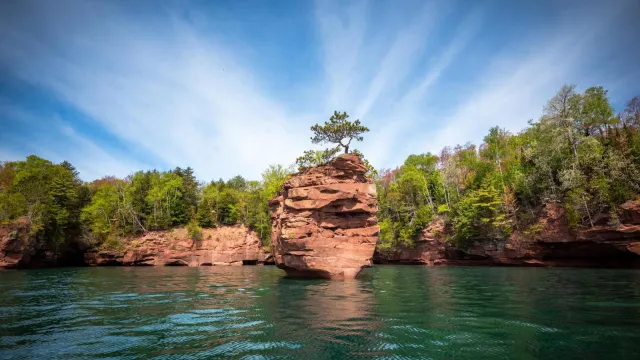 Photograph of Lake Superior sandstone rock stack under a blue sky.