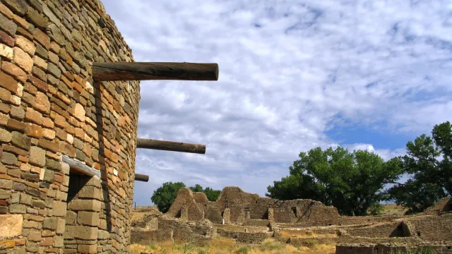 Reconstructed stone kiva amidst stone ruins