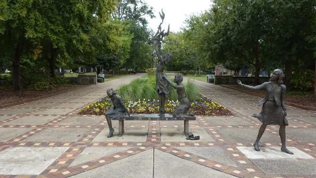 4 separate statues of the four little girls who were killed in the 16th st Baptist Church bombing