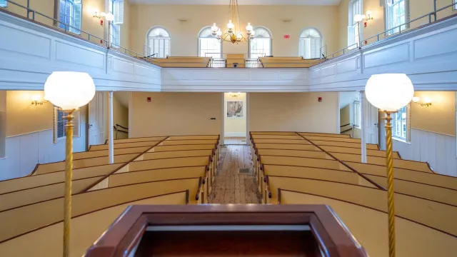 View from the pulpit at the African Meeting House, which has rows of benches and an upper gallery