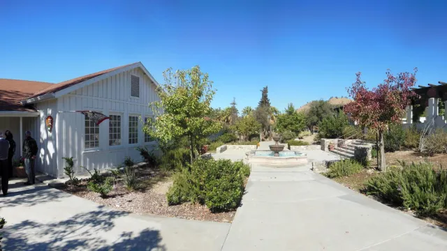 A walkway with a fountain