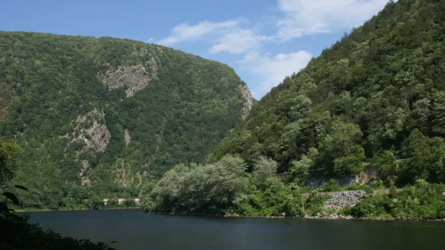View of the Delaware River cutting between two low mountain peaks