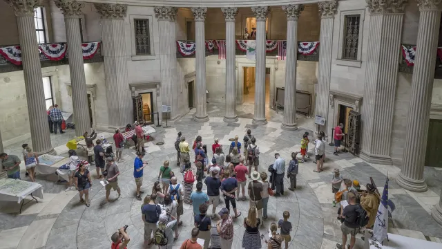 “Large crowd inside the rotunda of Federal Hall National Memorial”