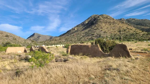 Ruins of the fort with mountains and valley in the background.