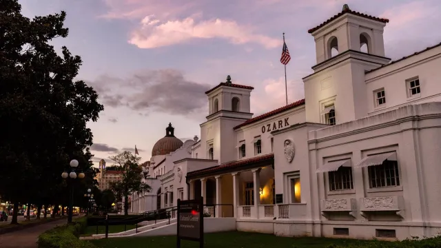 A pink sky above gentle white buildings