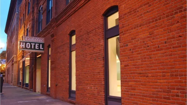 Large brick wall with glass windows.