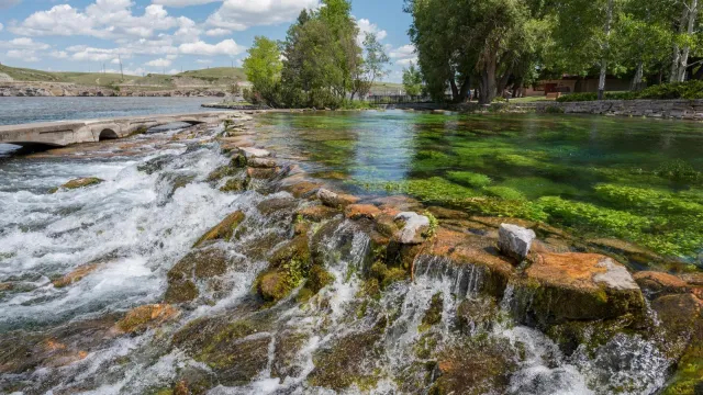 Small waterfall with brown rocks and green moss