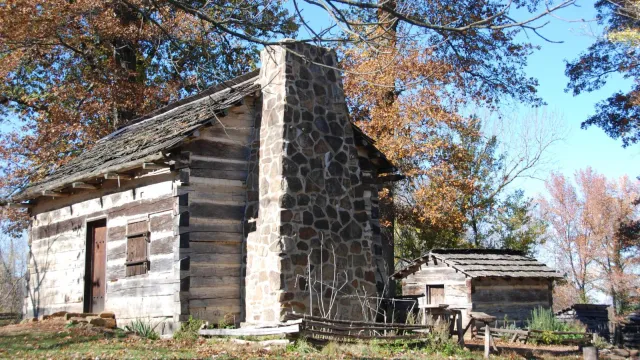 Cabin and smokehouse in the fall