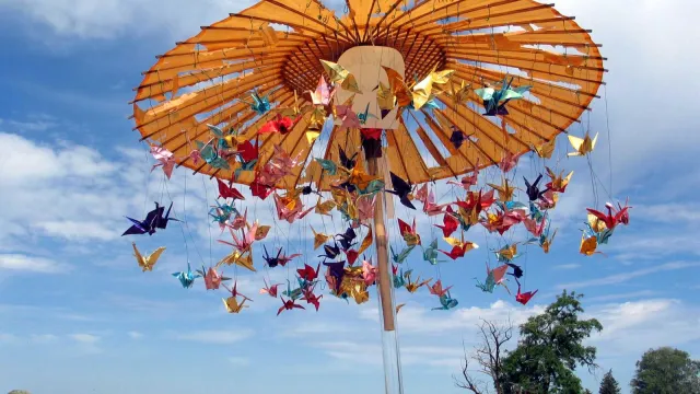Origami cranes twirl on carousel