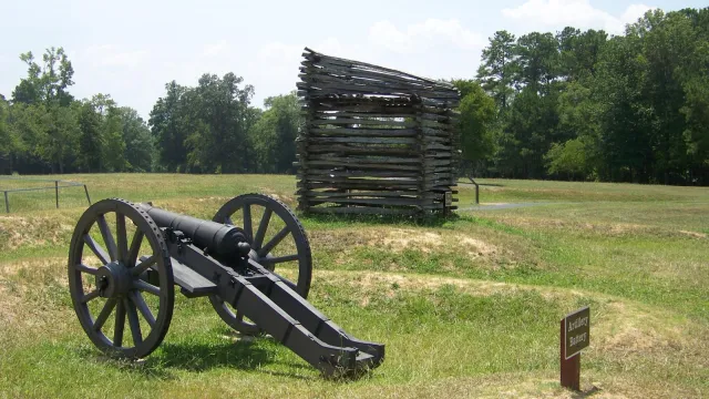 A cannon is in the left foreground with the Maham rifle tower in the distance.