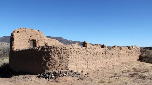 crumbling adobe structure with blue sky
