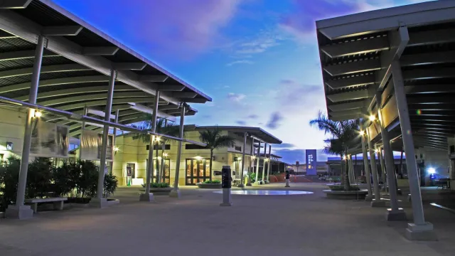 An evening photo of the Pearl Harbor Visitor Center Complex looking towards the museums.